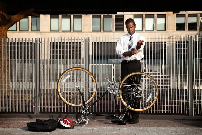 bicycle commuter repairing his bike bicycle commuter repairing his bike