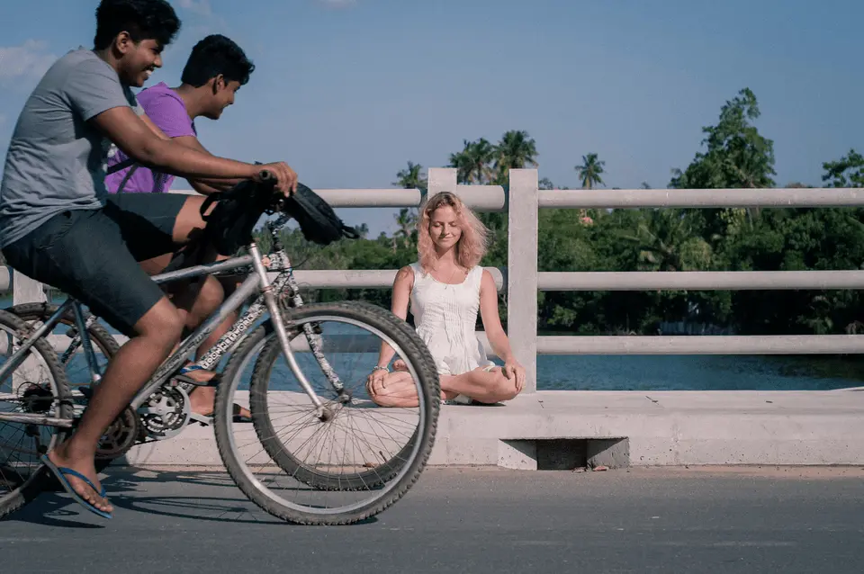 cyclsits on a bridge