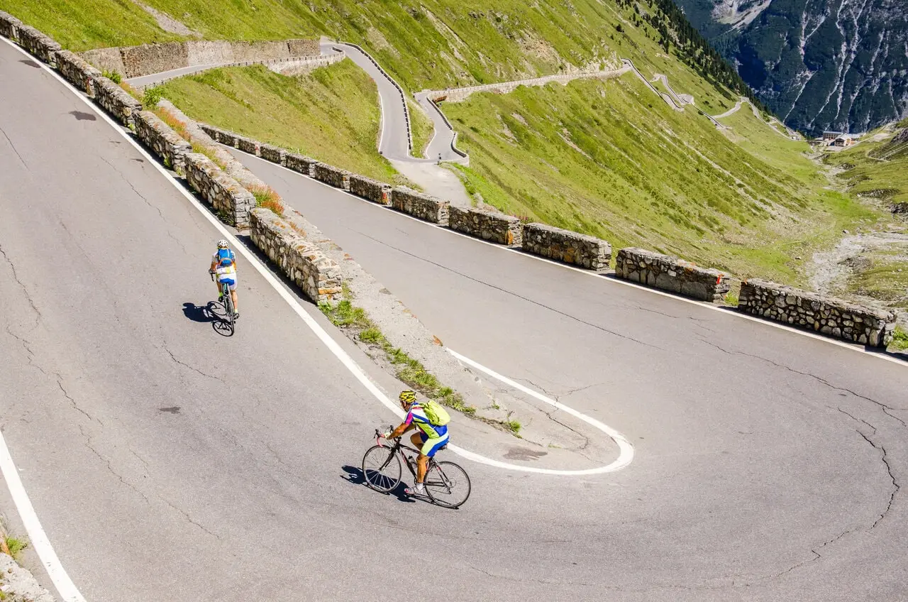 cyclists climbing a hill cyclists climbing a hill