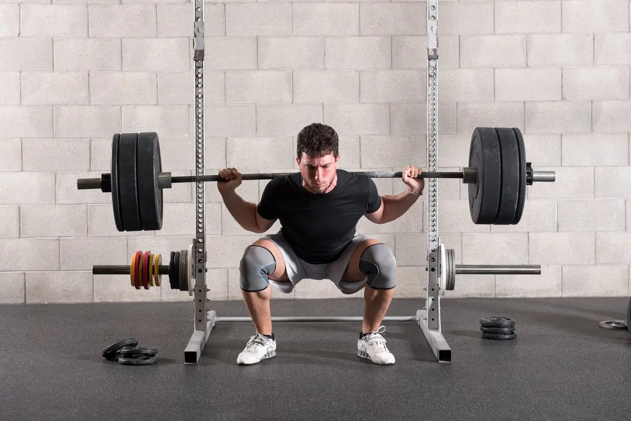 cyclist doing squats athlete training squats