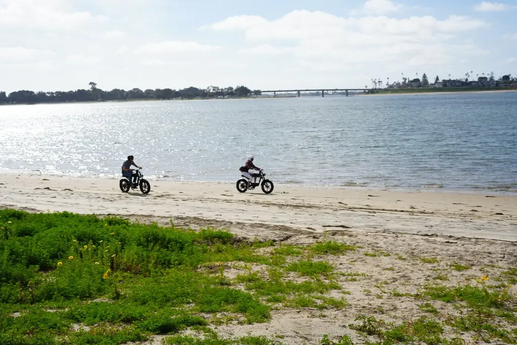 moped style ebikes on a beach moped style ebikes on a beach