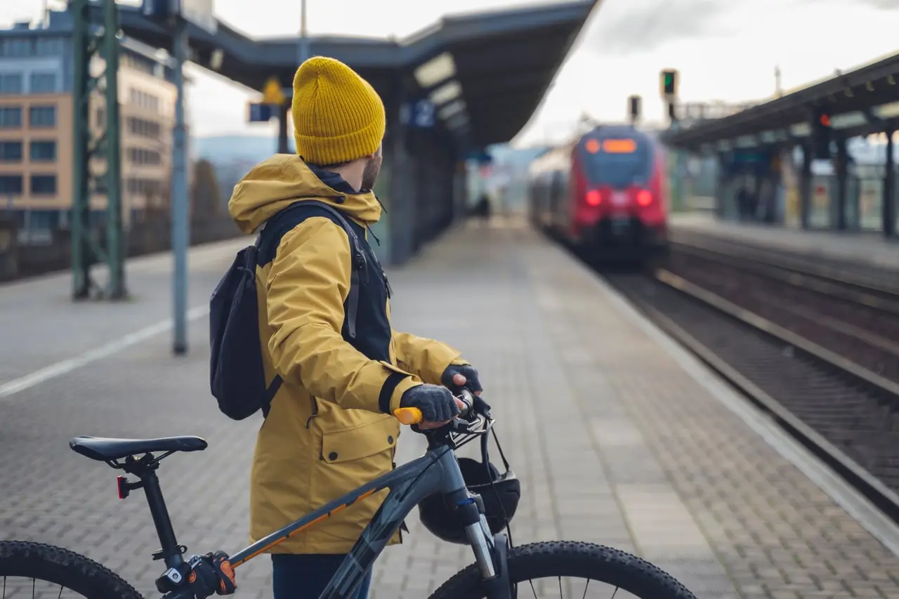 bicycle commuter waiting for a train bicycle commuter waiting for a train