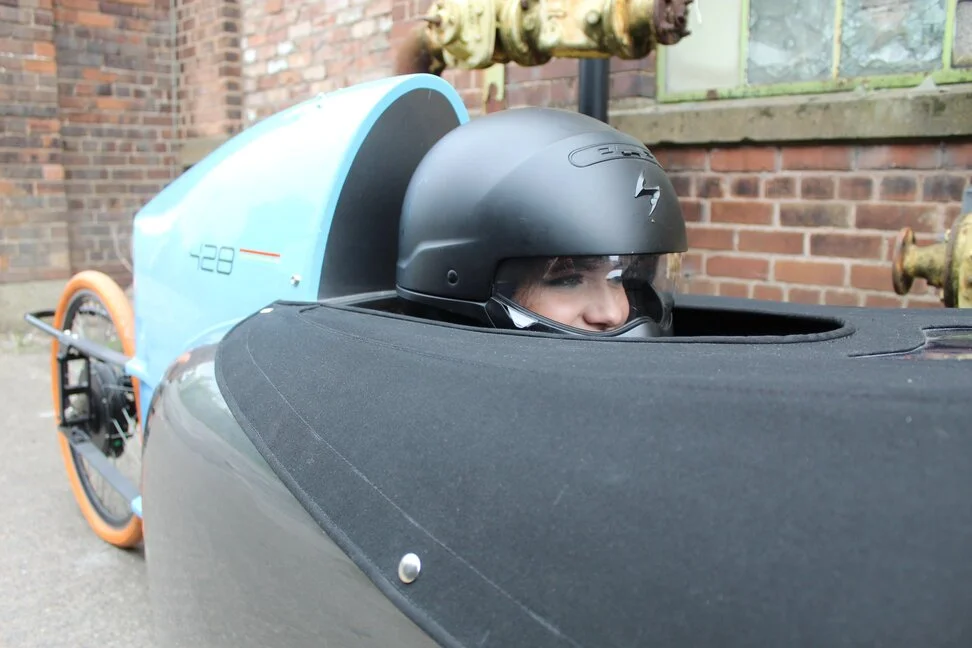 velomobile rider in helmet