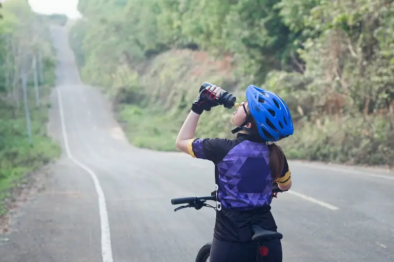 cyclist drinking water