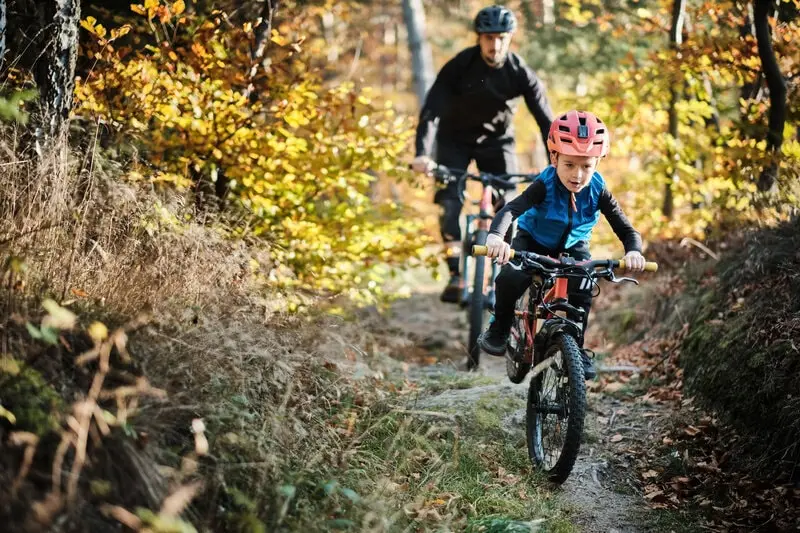 father and son mountain biking father and son mountain biking