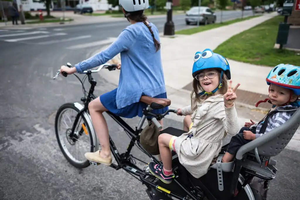 kids with parent on e-cargo bike kids with parent on e-cargo bike