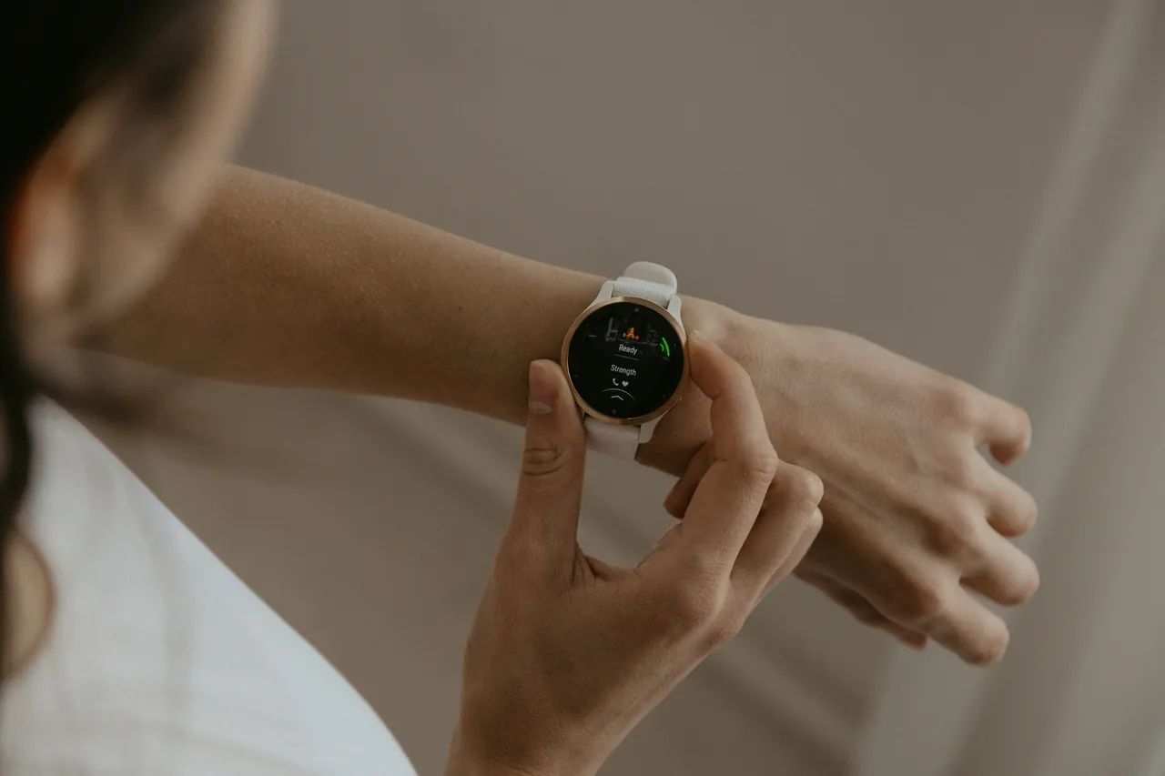 Athlete checking the readout on a wrist-worn sports watch