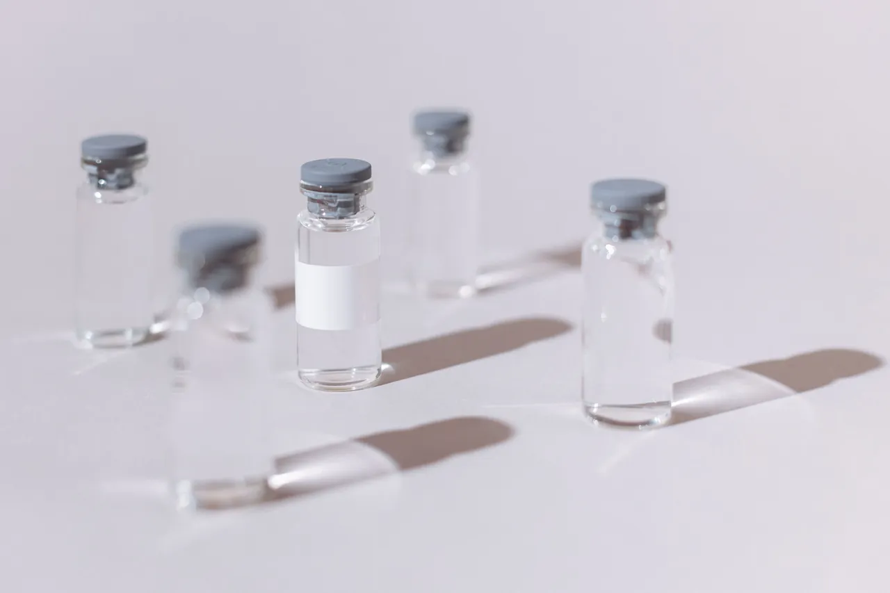 Freeze-dried peptide vials look like any other pharmaceutical vial, which is part of the appeal Five small clear glass vials with metal crimp caps standing on a white table