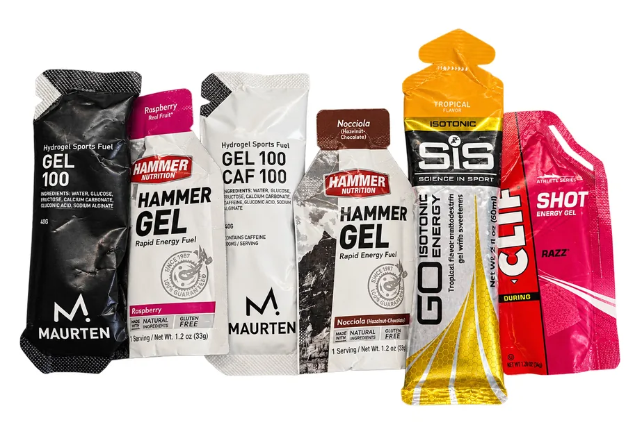 Six energy gel packets side by side: Maurten Gel 100, Hammer Gel, Maurten Gel 100 Caf, SiS Go Isotonic and Clif Shot