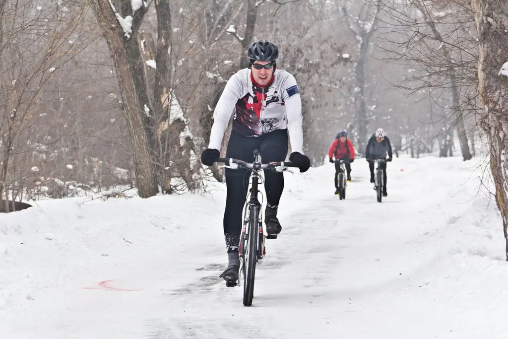 cyclist riding in winter cyclist riding in winter