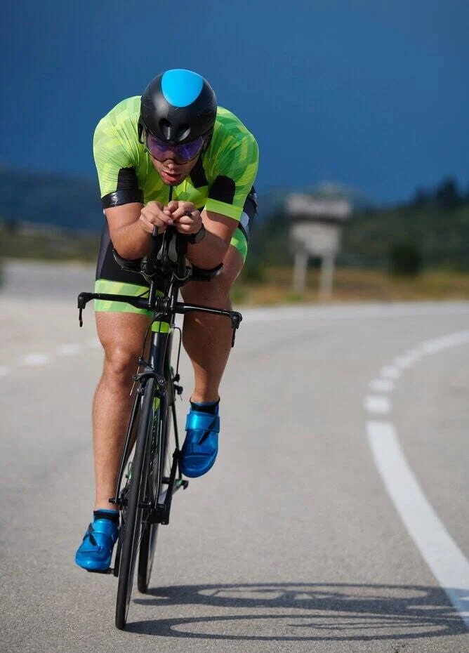 Triathlete riding a time-trial bike