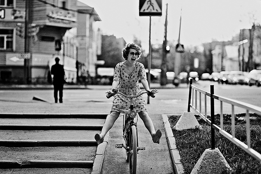 woman happy on a bike